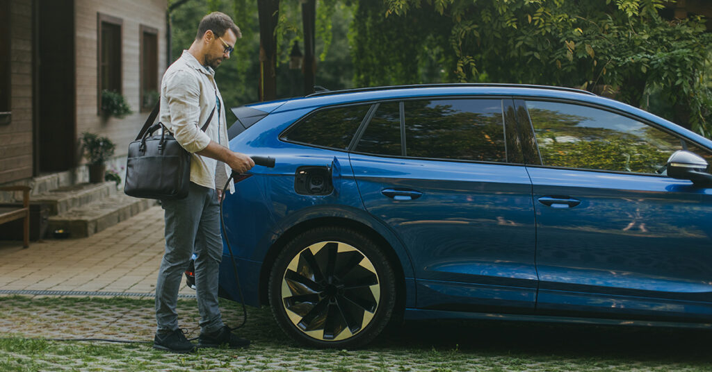 man opening electric car